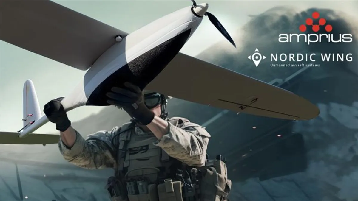 A soldier prepares to launch a drone, showcasing advanced unmanned aircraft technology, with branding from Amprius and Nordic Wing.