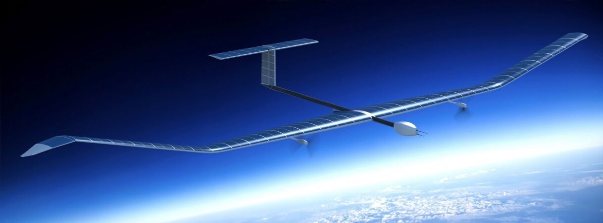 A large solar-powered drone glides gracefully above the Earth, showcasing its sleek design against a deep blue sky.