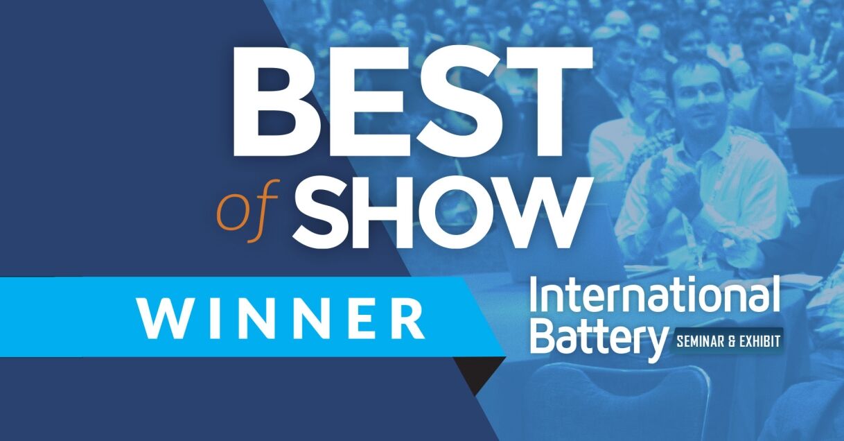 A promotional banner announcing the 'Best of Show Winner' at the International Battery Seminar and Exhibit, with an audience in the background.