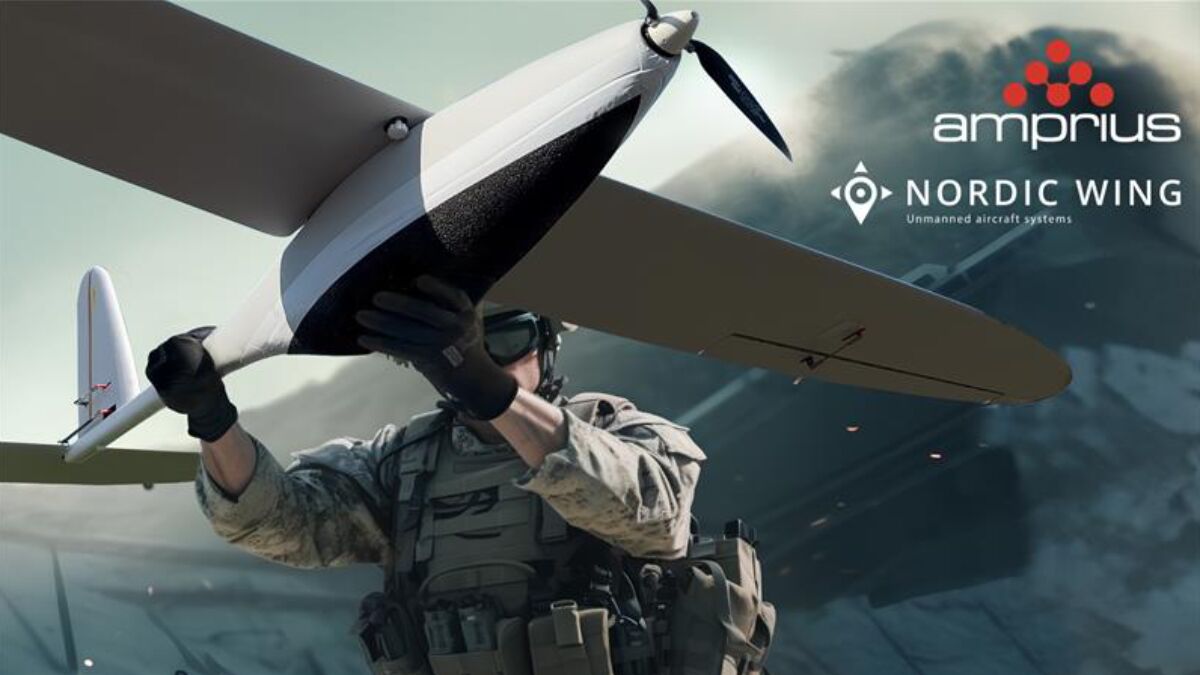 A soldier prepares to launch a drone, showcasing advanced unmanned aircraft technology, with branding from Amprius and Nordic Wing.