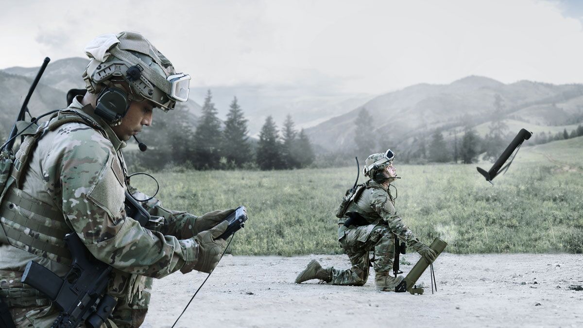 Two soldiers in tactical gear are engaged in military operations in a scenic, mountainous landscape, one kneeling with equipment and the other using a device.