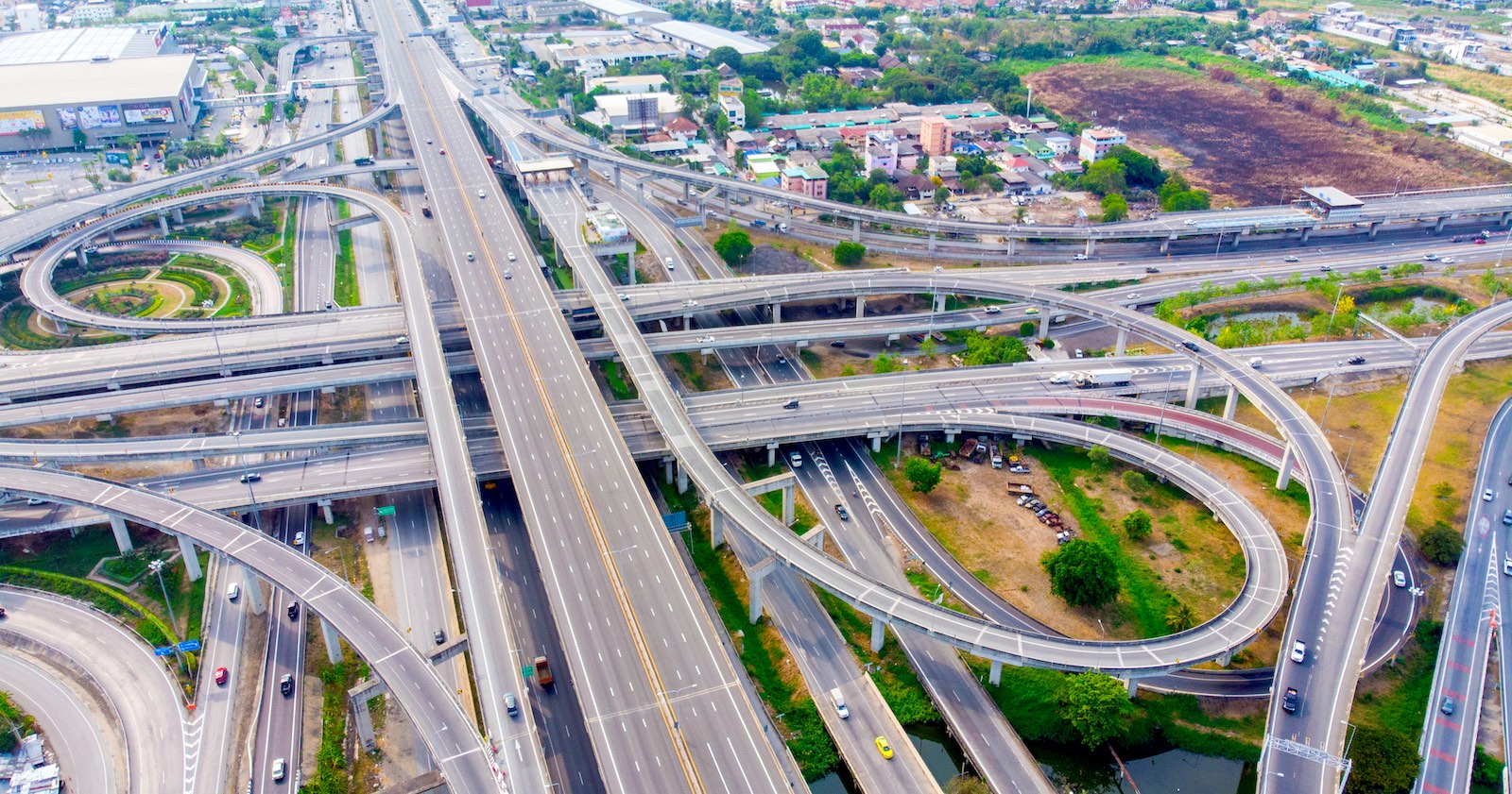 Modern freeway interchange demonstrating city transport and electric mobility.