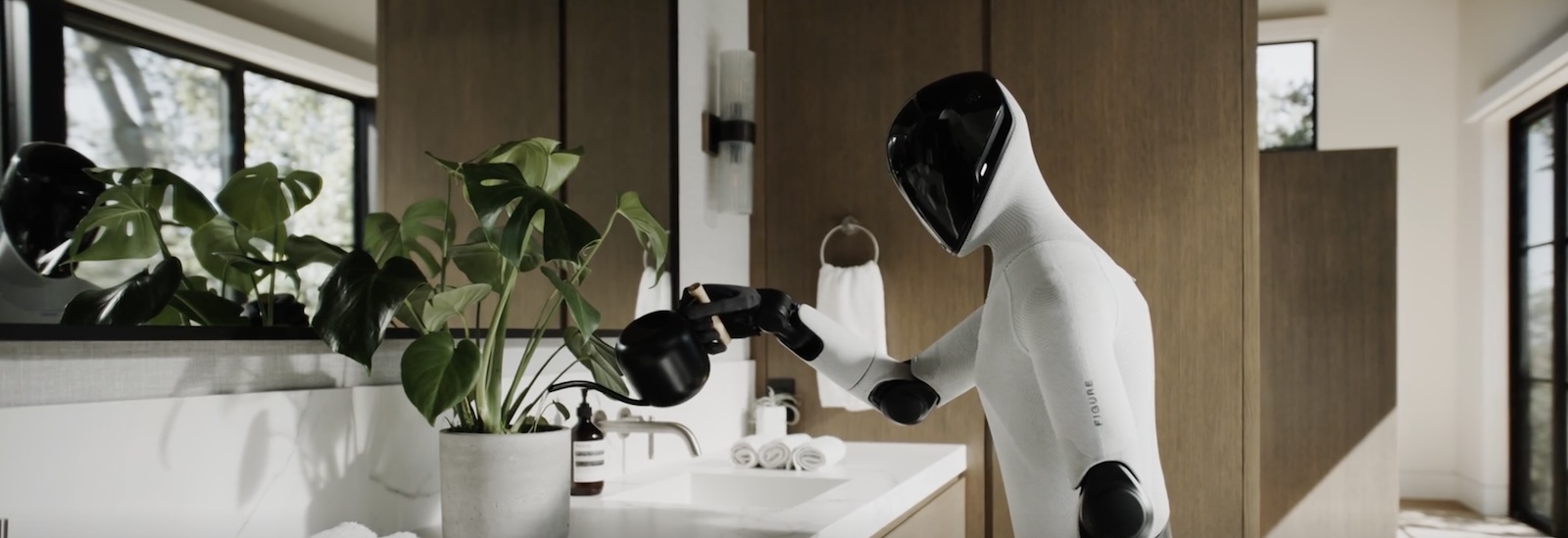 Humanoid robot from Figure AI watering a plant in a residence as part of a demonstration of humanoid capability